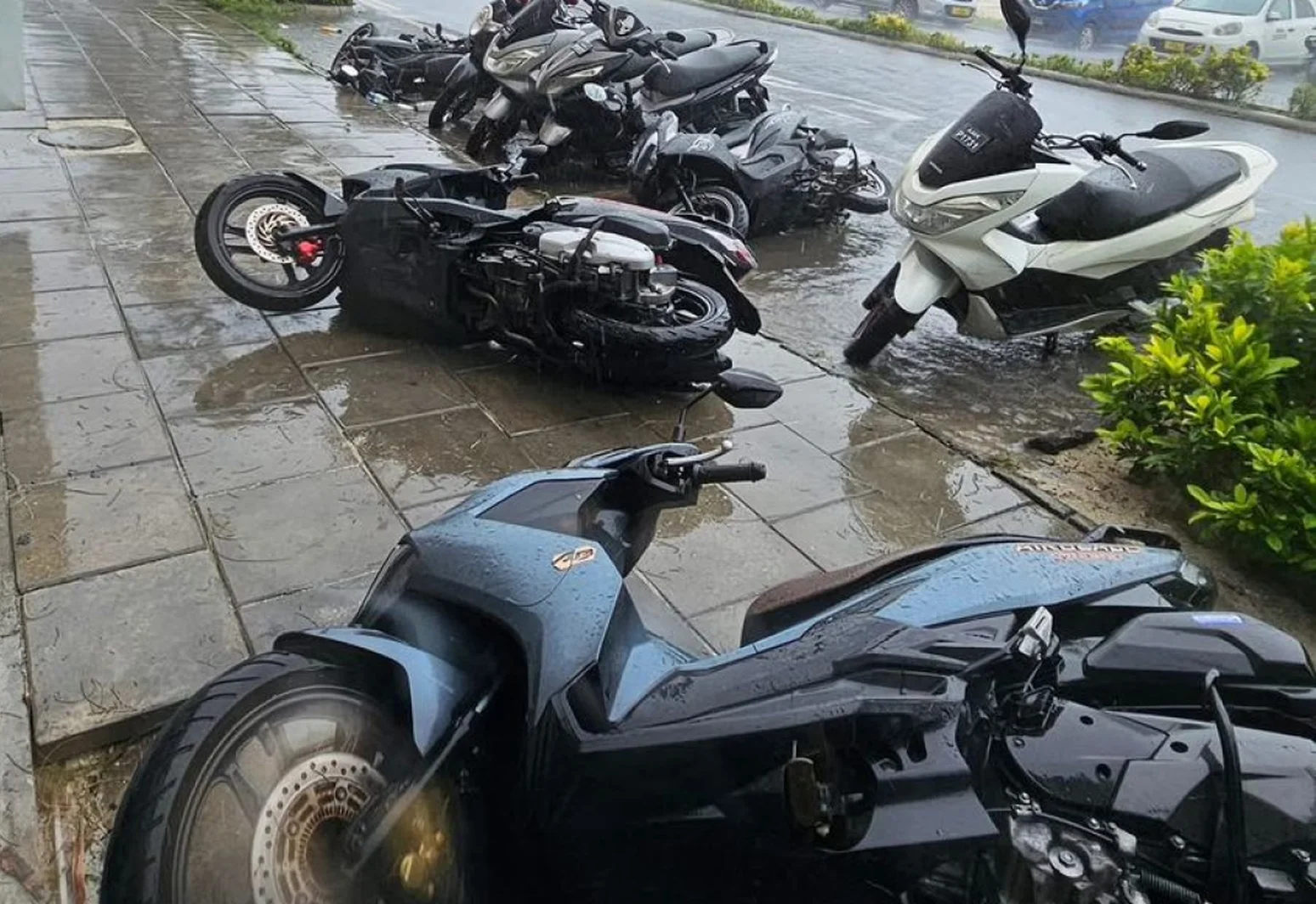 Parked motorcycles toppled in Hulhumale' due to strong winds, 2025 | Photo: Edition Mv