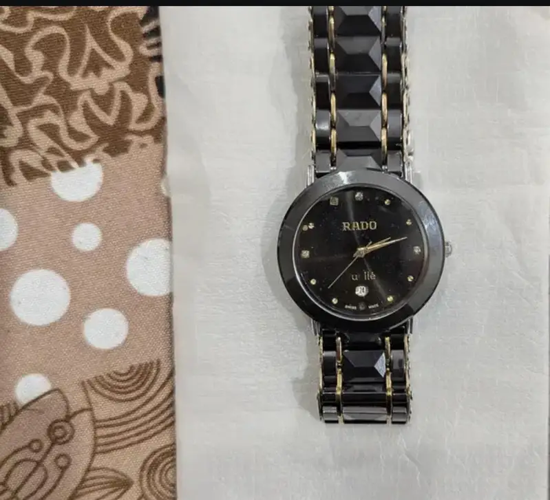 GENUINE GOLDEN BLACK RADO WATCH FOR SALE. 10/10