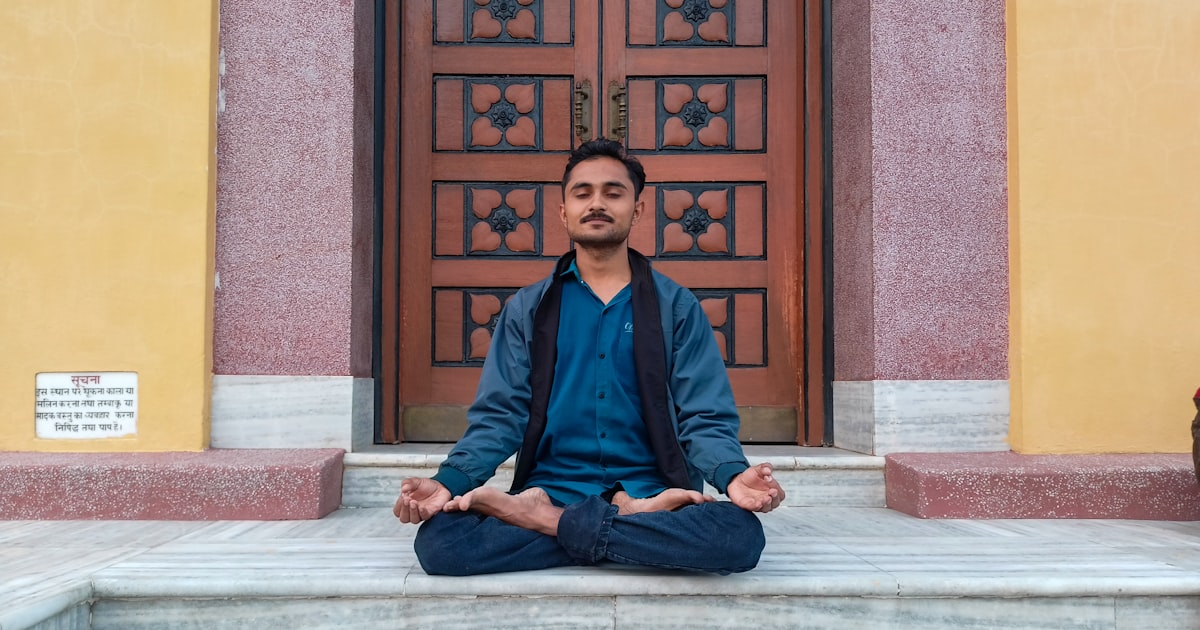 Young Indian person sitting thoughtfully by a window with chai, reflecting on life decisions|alt:Am I ready for marriage —...