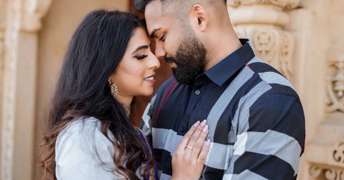 Indian couple having a respectful conversation with parents in a living room, warm and hopeful atmosphere|alt:How to convi...
