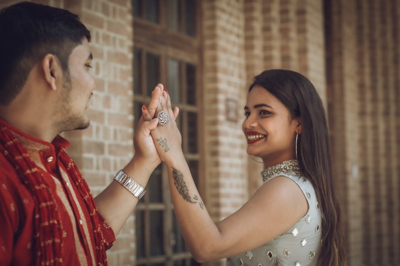 Happy Indian couple smiling together after a successful modern arranged marriage match