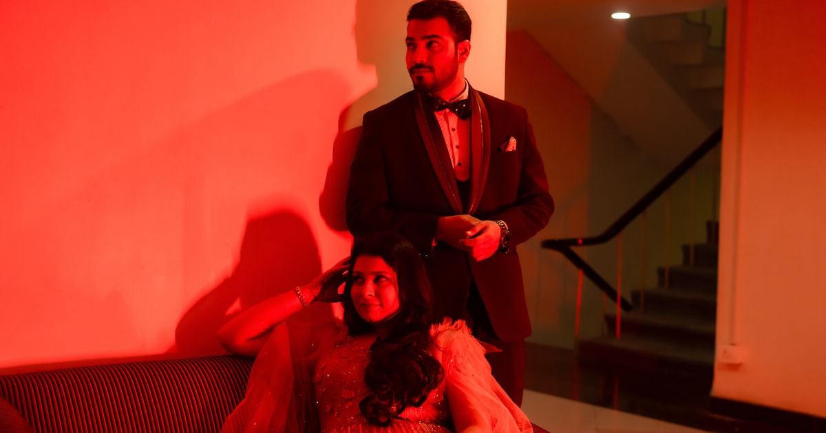 Indian couple having a video call on a laptop during a modern arranged marriage rishta process with warm lighting