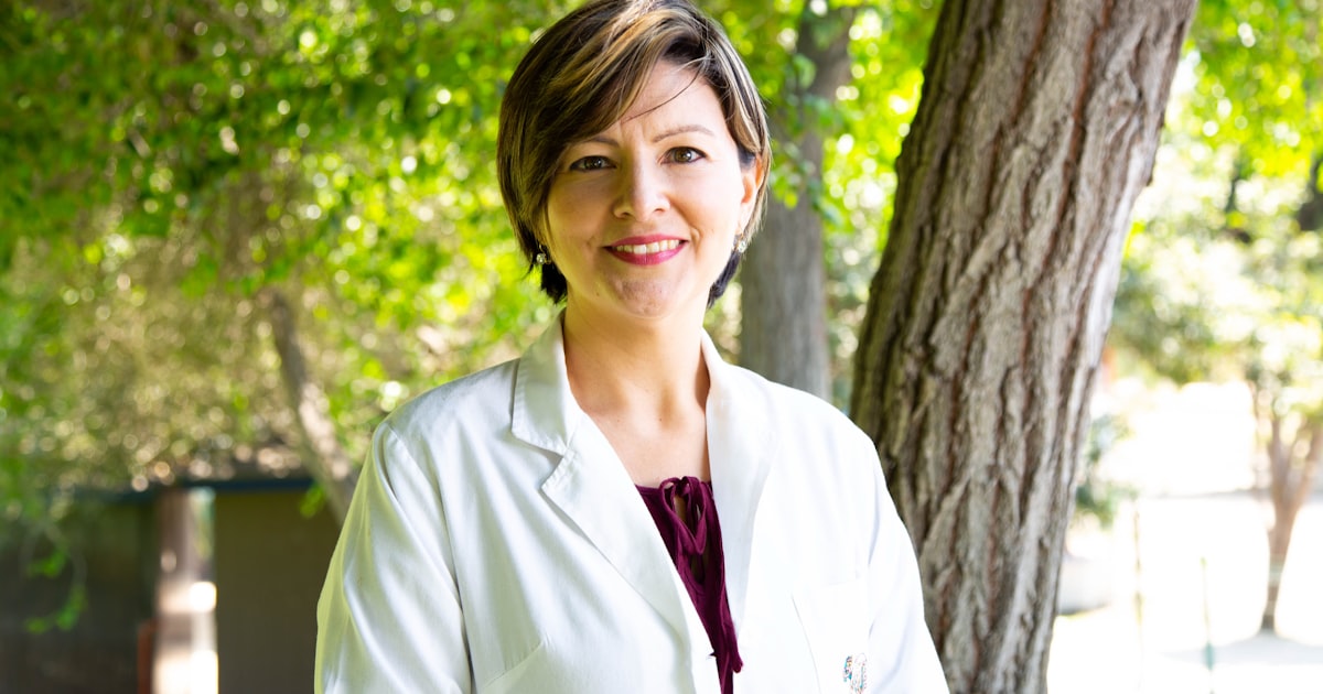 woman standing under tree