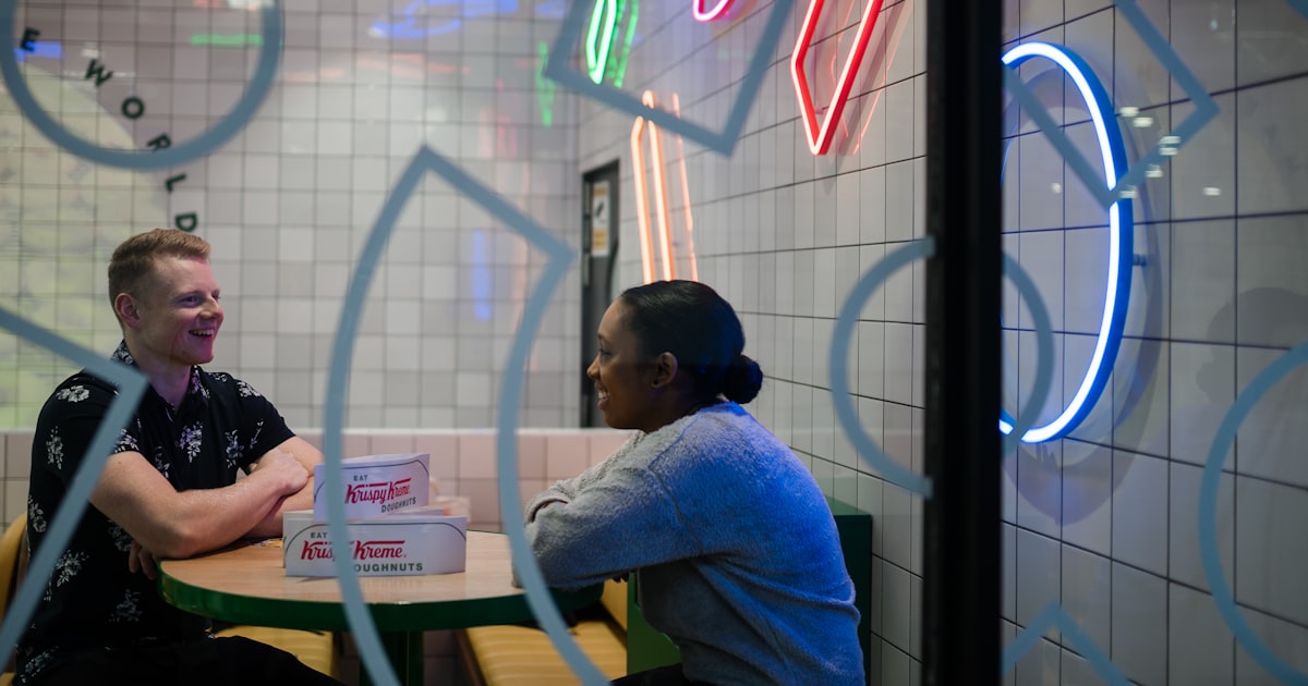 man and woman walking inside store