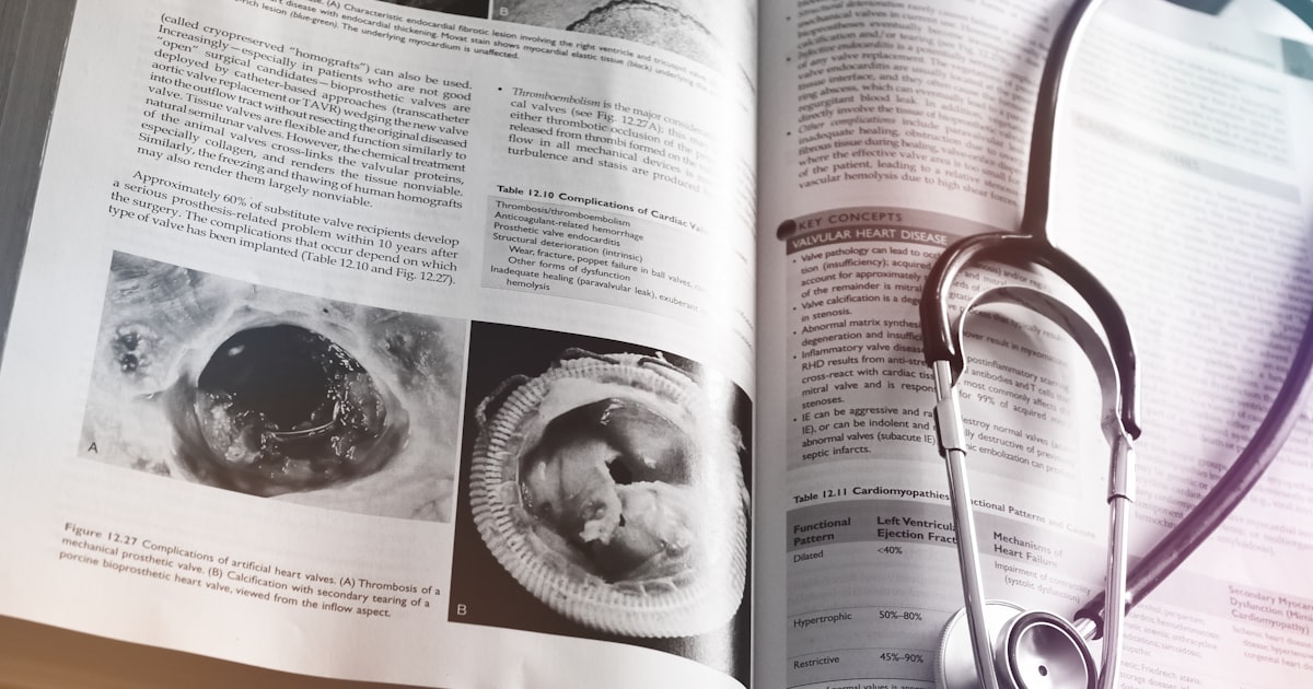 a medical book with a stethoscope on top of it