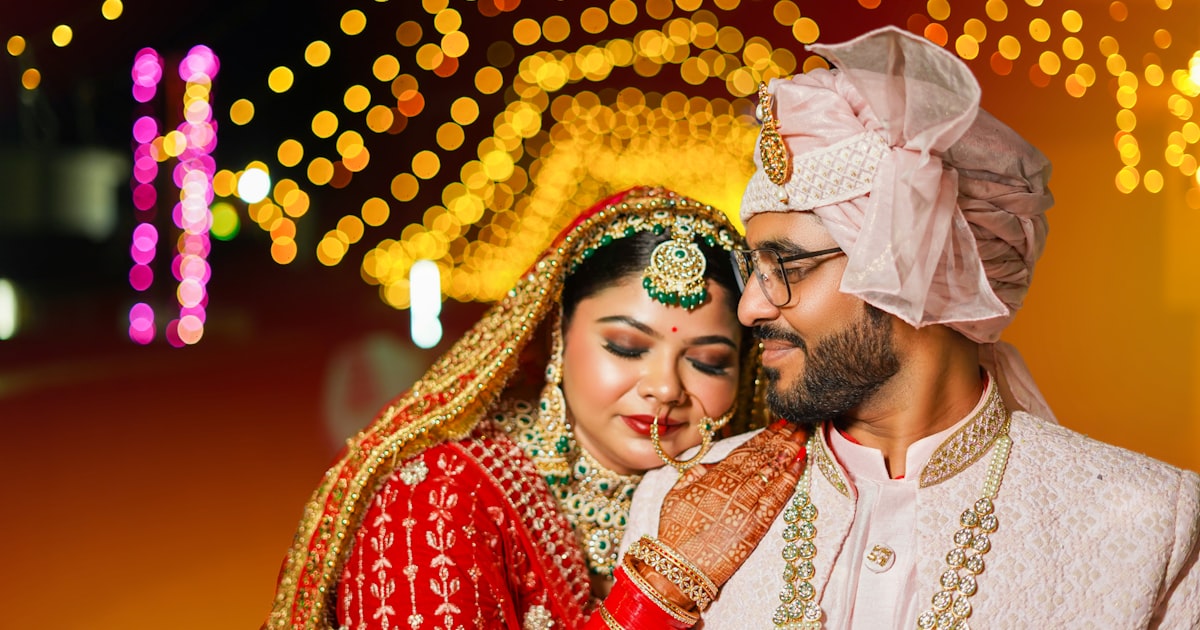 A bride and groom posing for a picture