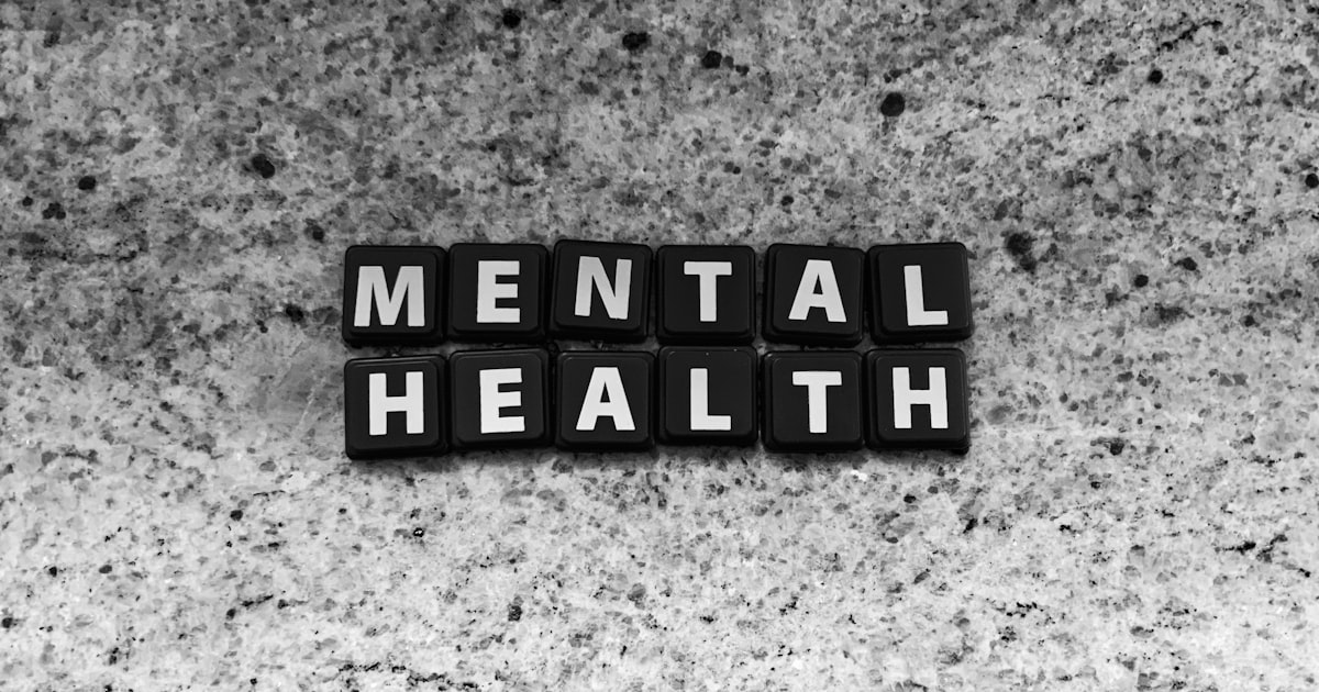 a black and white photo of the word mental health